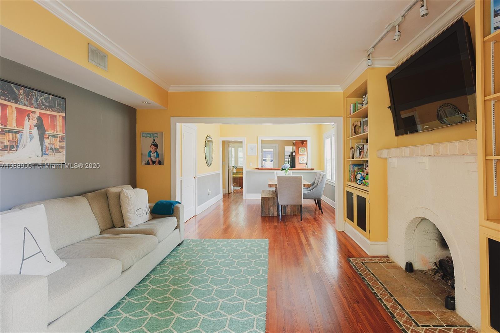 210 Southwest 19th Road Miami, FL 33129 - Photo 12 of 33 a living room with furniture and a flat screen tv
