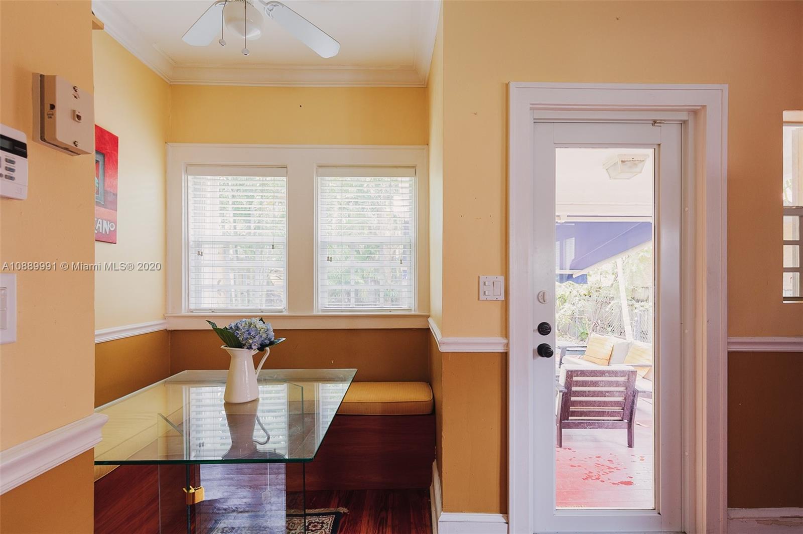 210 Southwest 19th Road Miami, FL 33129 - Photo 13 of 33 a view of a dining room with furniture and a window