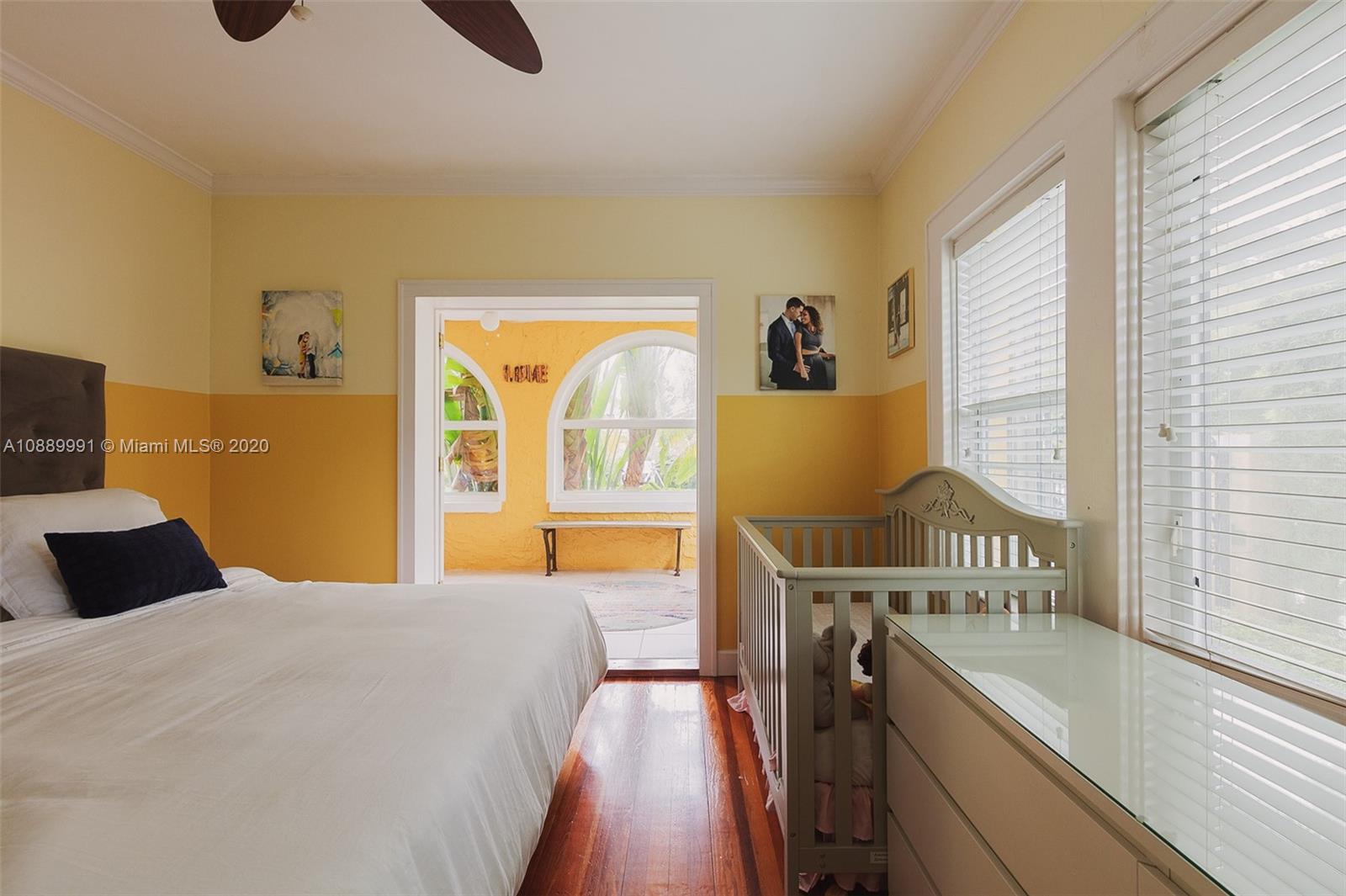 210 Southwest 19th Road Miami, FL 33129 - Photo 15 of 33 a bedroom with a bed and a window