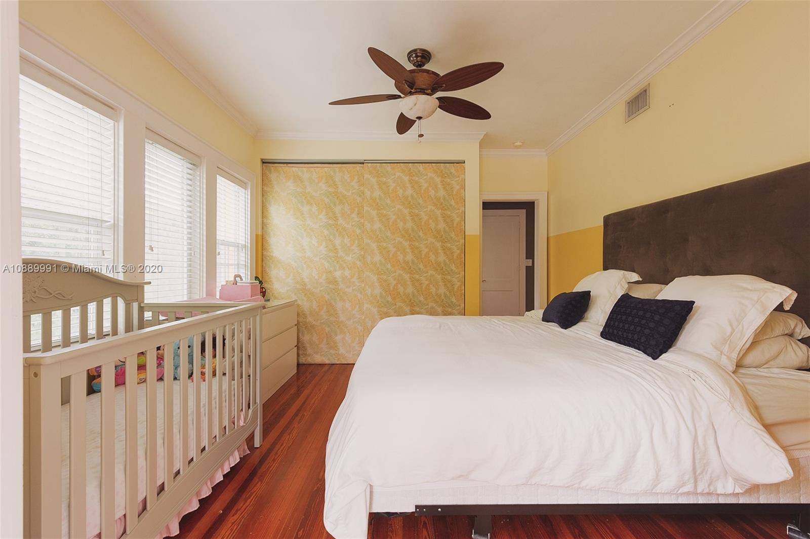 210 Southwest 19th Road Miami, FL 33129 - Photo 16 of 33 a bed room with a bed and a window