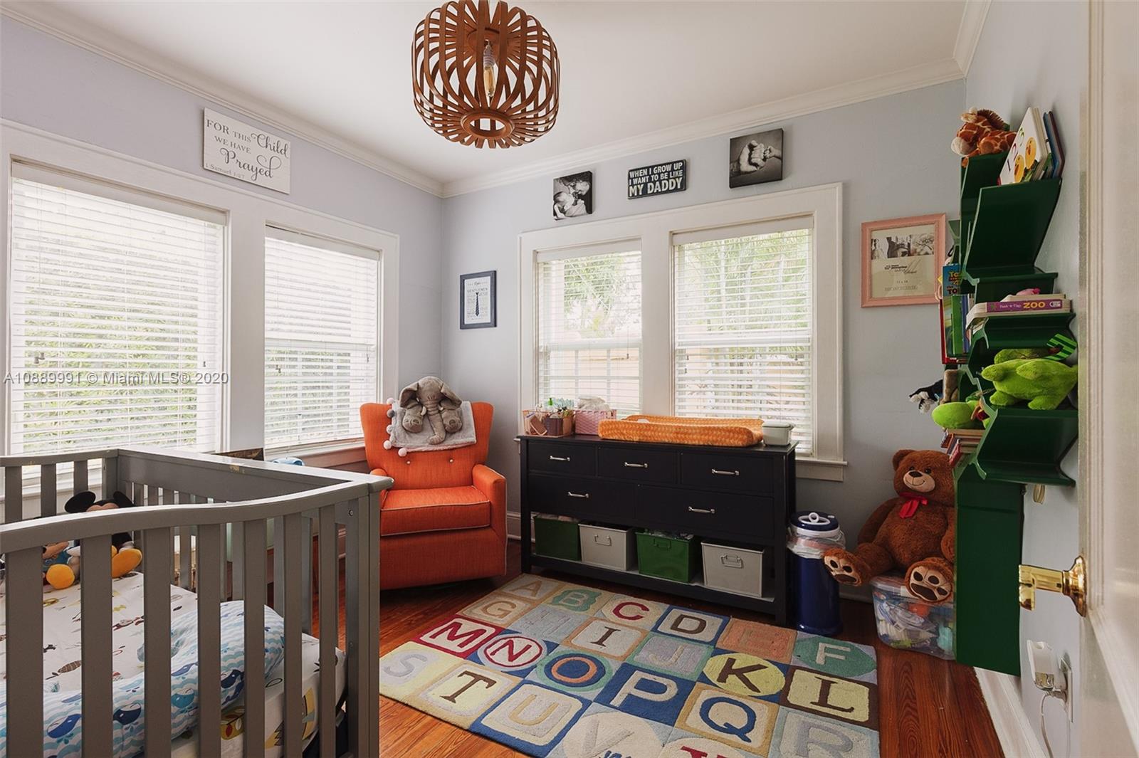 210 Southwest 19th Road Miami, FL 33129 - Photo 20 of 33 a bedroom with furniture and a window