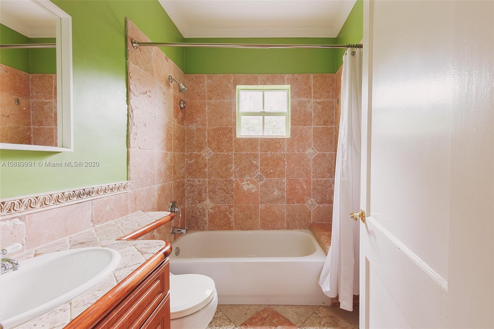 210 Southwest 19th Road Miami, FL 33129 - Photo 21 of 33 a bathroom with a toilet a sink and bathtub