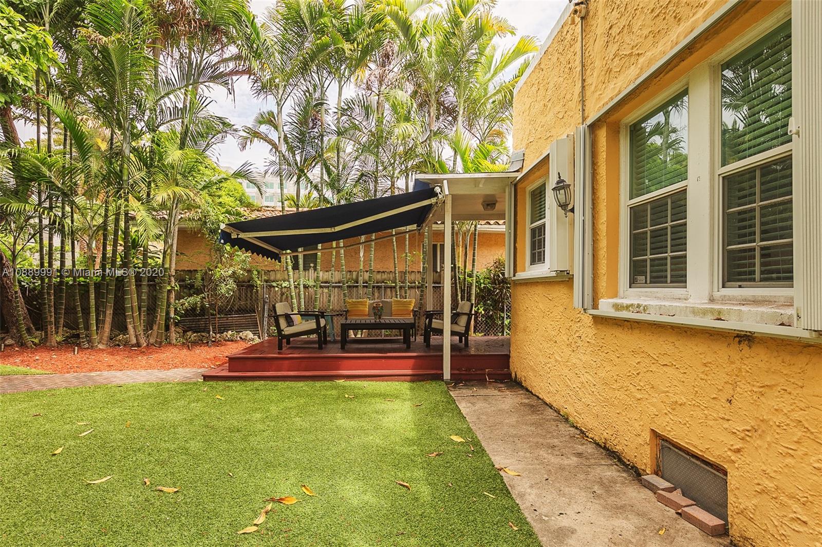 210 Southwest 19th Road Miami, FL 33129 - Photo 22 of 33 front view of a house with a yard