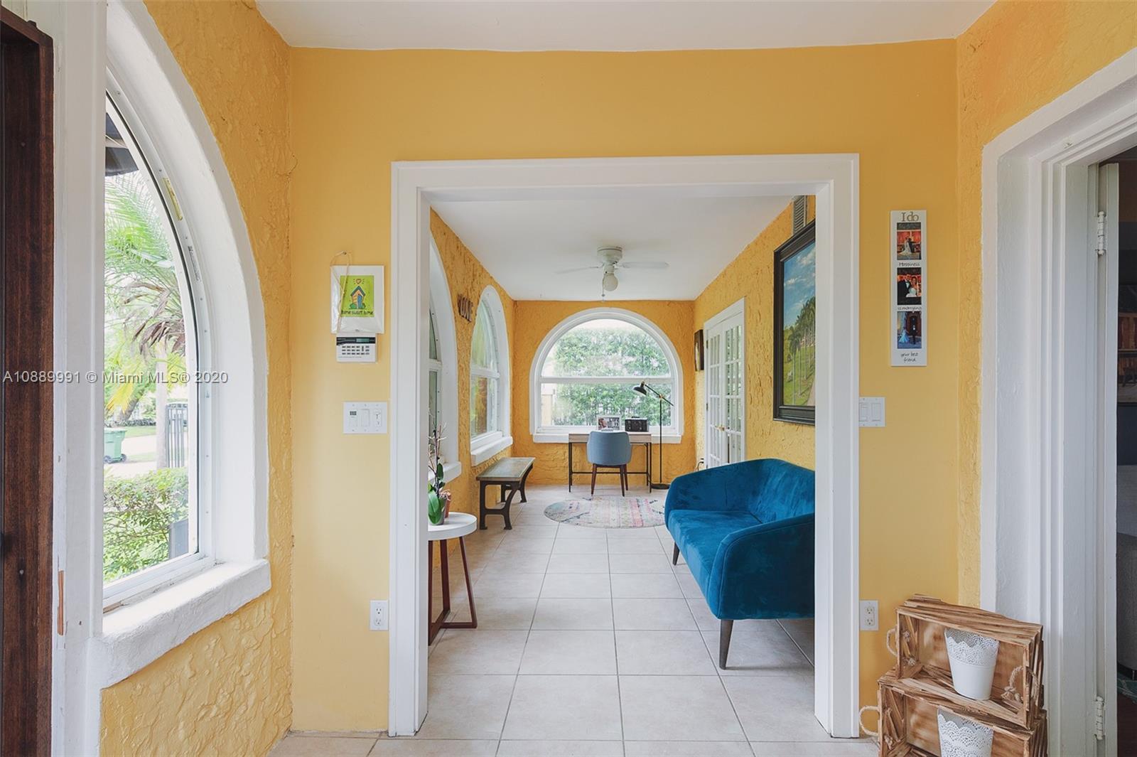 210 Southwest 19th Road Miami, FL 33129 - Photo 4 of 33 a view of living room with furniture and a large window