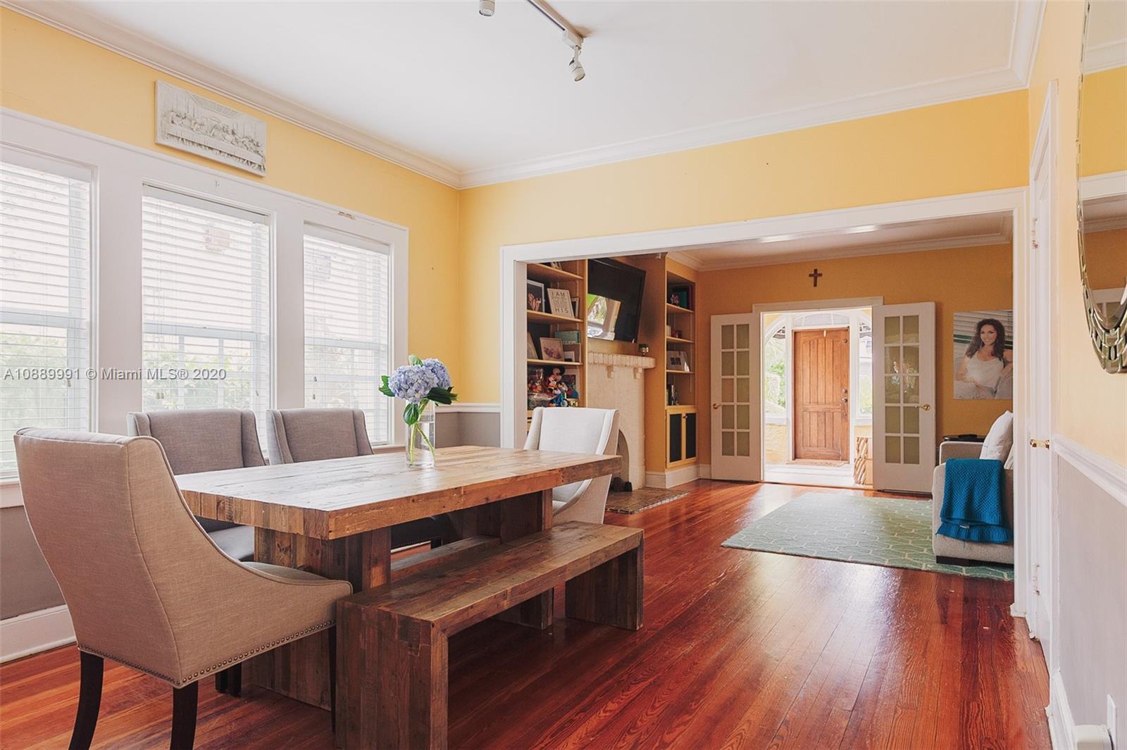 210 Southwest 19th Road Miami, FL 33129 - Photo 5 of 33 a dining room with furniture and wooden floor