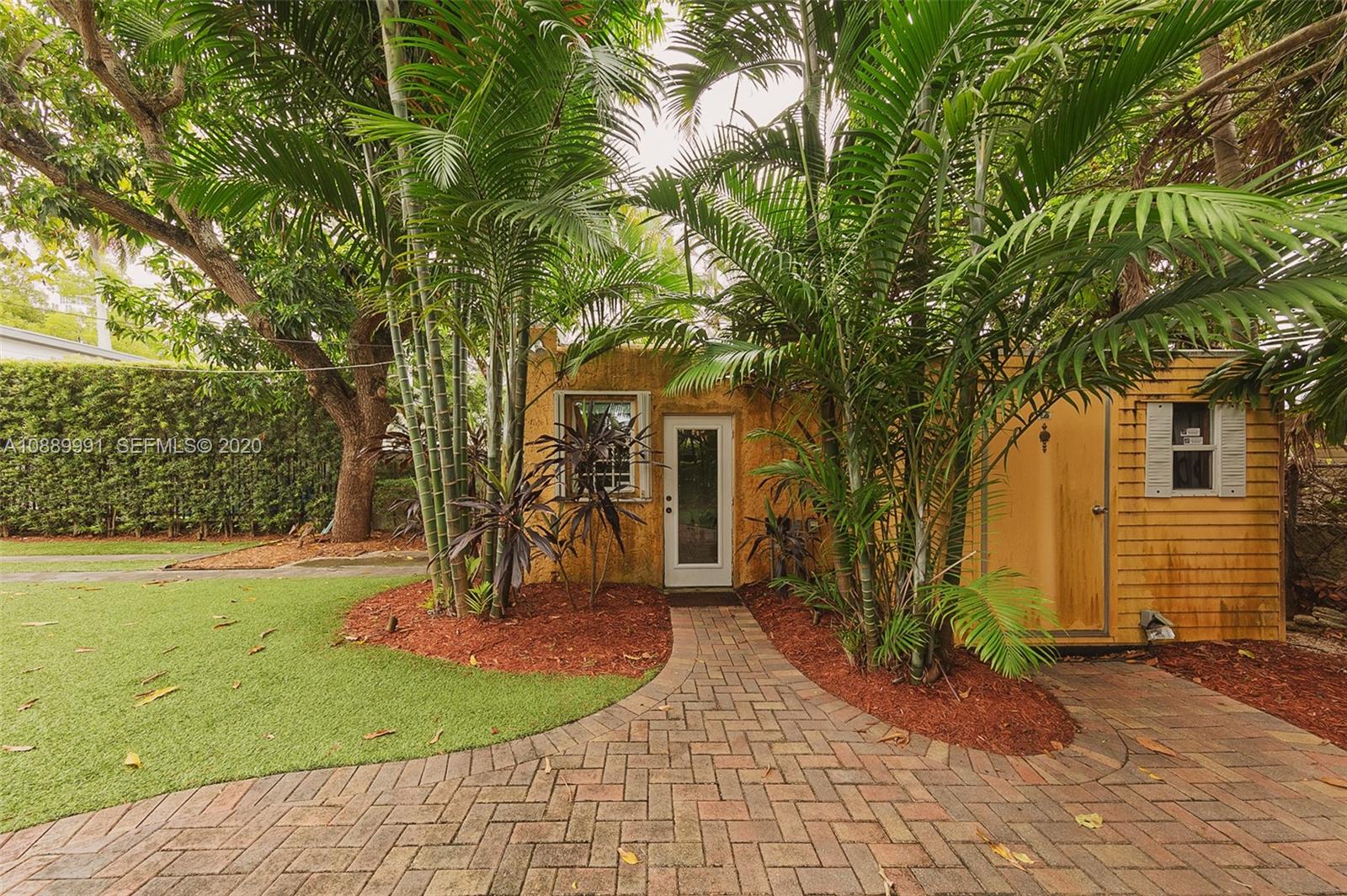 210 Southwest 19th Road Miami, FL 33129 - Photo 7 of 33 a front view of a house with a yard