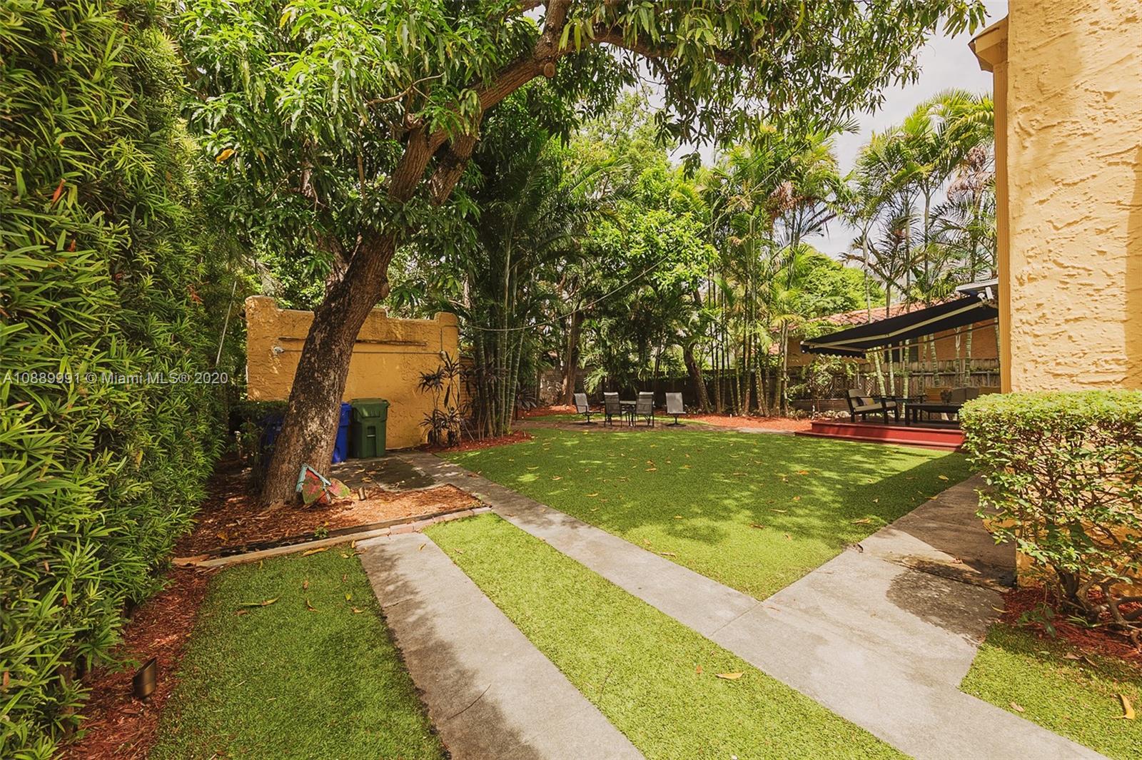 210 Southwest 19th Road Miami, FL 33129 - Photo 8 of 33 a view of a house with garden and trees
