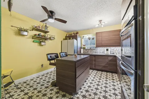 a bathroom with a bathtub sink and mirror