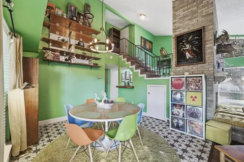 a view of a chairs and table in a patio