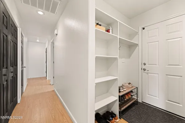 a view of room with stairs and a closet