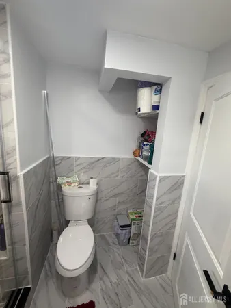 a bathroom with a toilet and a sink