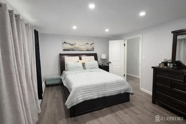 a bedroom with a bed and a dresser