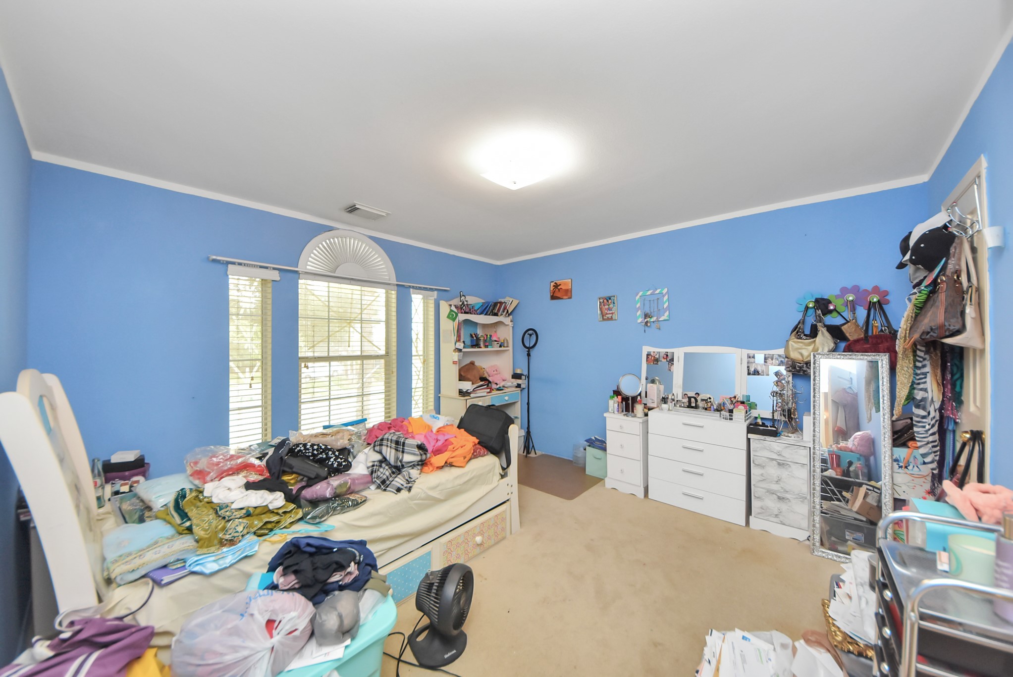 10003 Dakota Ridge Court Houston, TX 77095 - Photo 22 of 30 a bed sitting in a bedroom next to a window