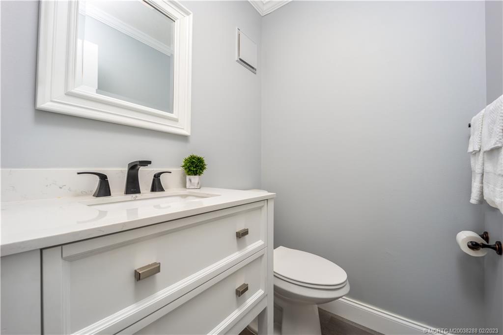 5313 Southeast Miles Grant Road, Unit K209 Stuart, FL 34997 - Photo 16 of 20 a bathroom with a sink and a toilet