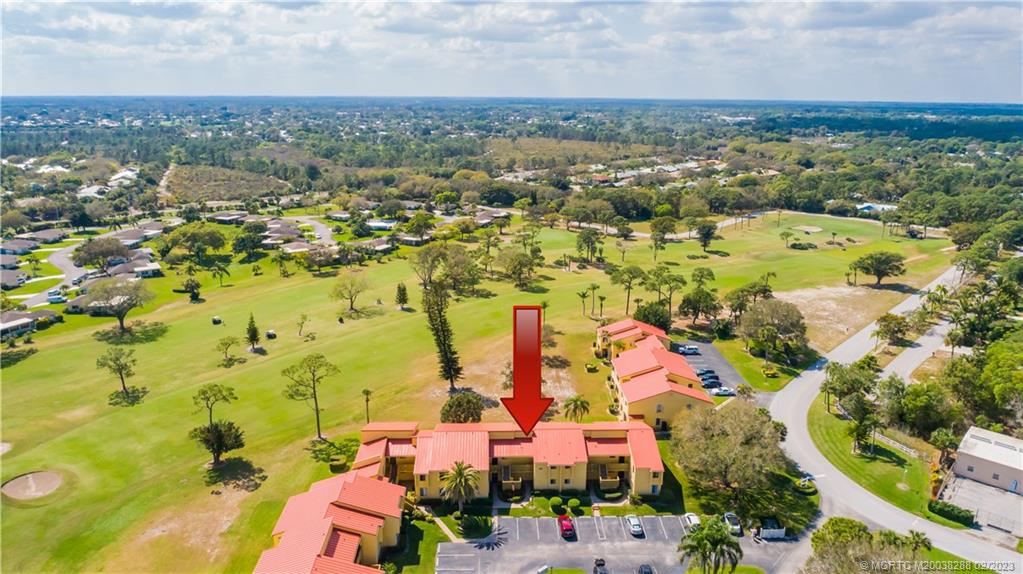 5313 Southeast Miles Grant Road, Unit K209 Stuart, FL 34997 - Photo 19 of 20 an aerial view of residential houses with outdoor space