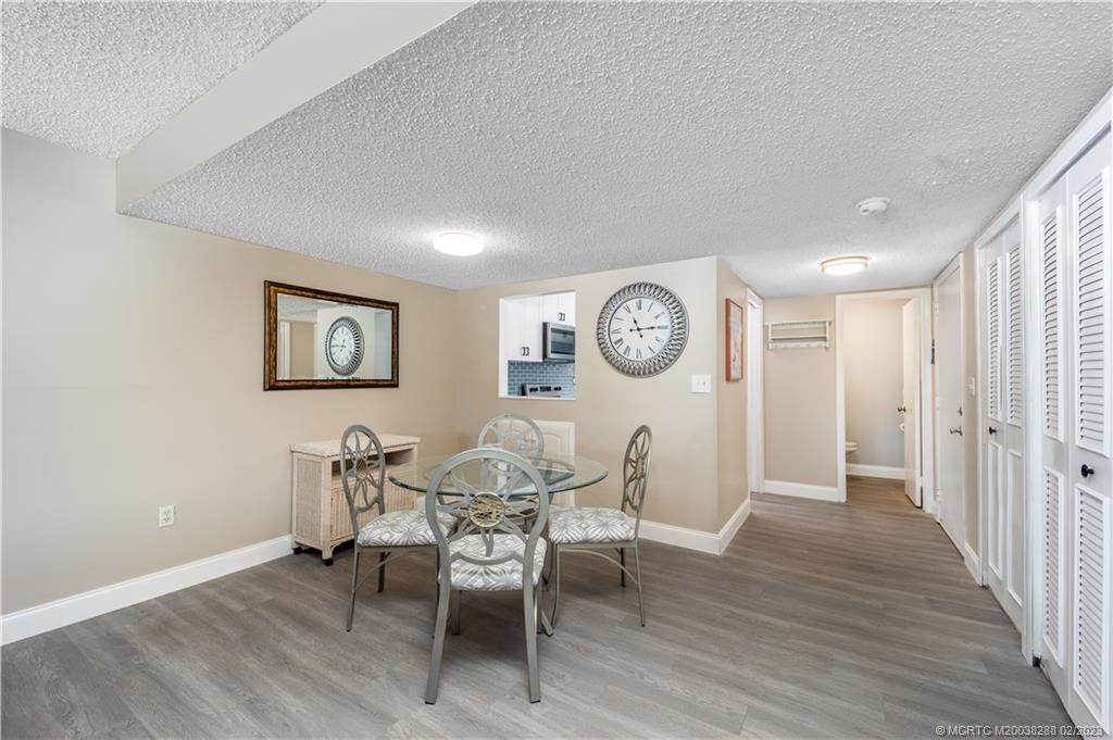 5313 Southeast Miles Grant Road, Unit K209 Stuart, FL 34997 - Photo 5 of 20 a view of a dining room with furniture and a window