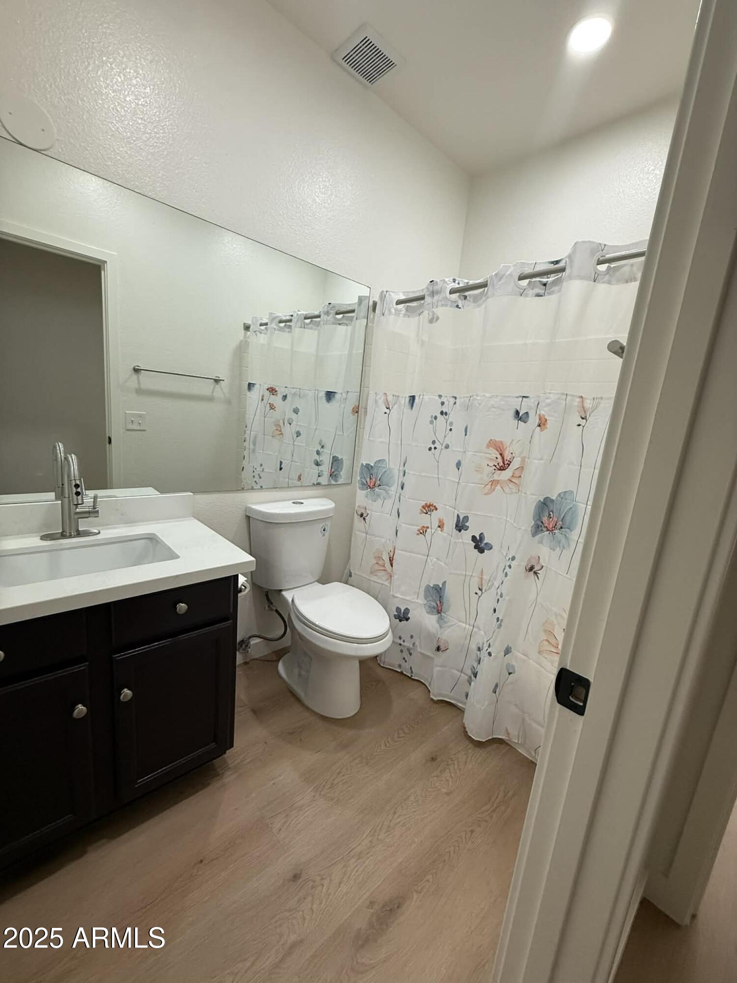 1633 East Lakeside Drive, Unit 65 Gilbert, AZ 85234 - Photo 12 of 12 a bathroom with a sink a toilet and shower