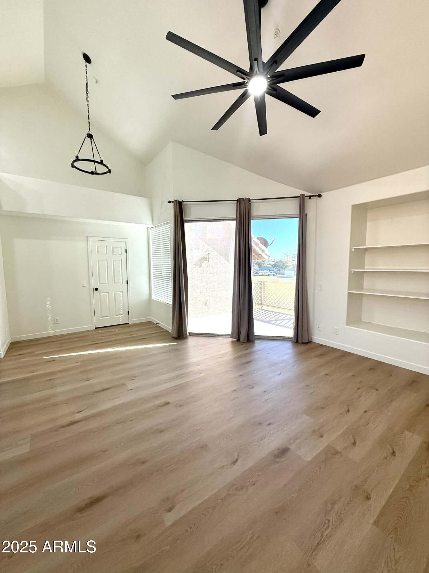 1633 East Lakeside Drive, Unit 65 Gilbert, AZ 85234 - Photo 3 of 12 a view of an empty room with a window
