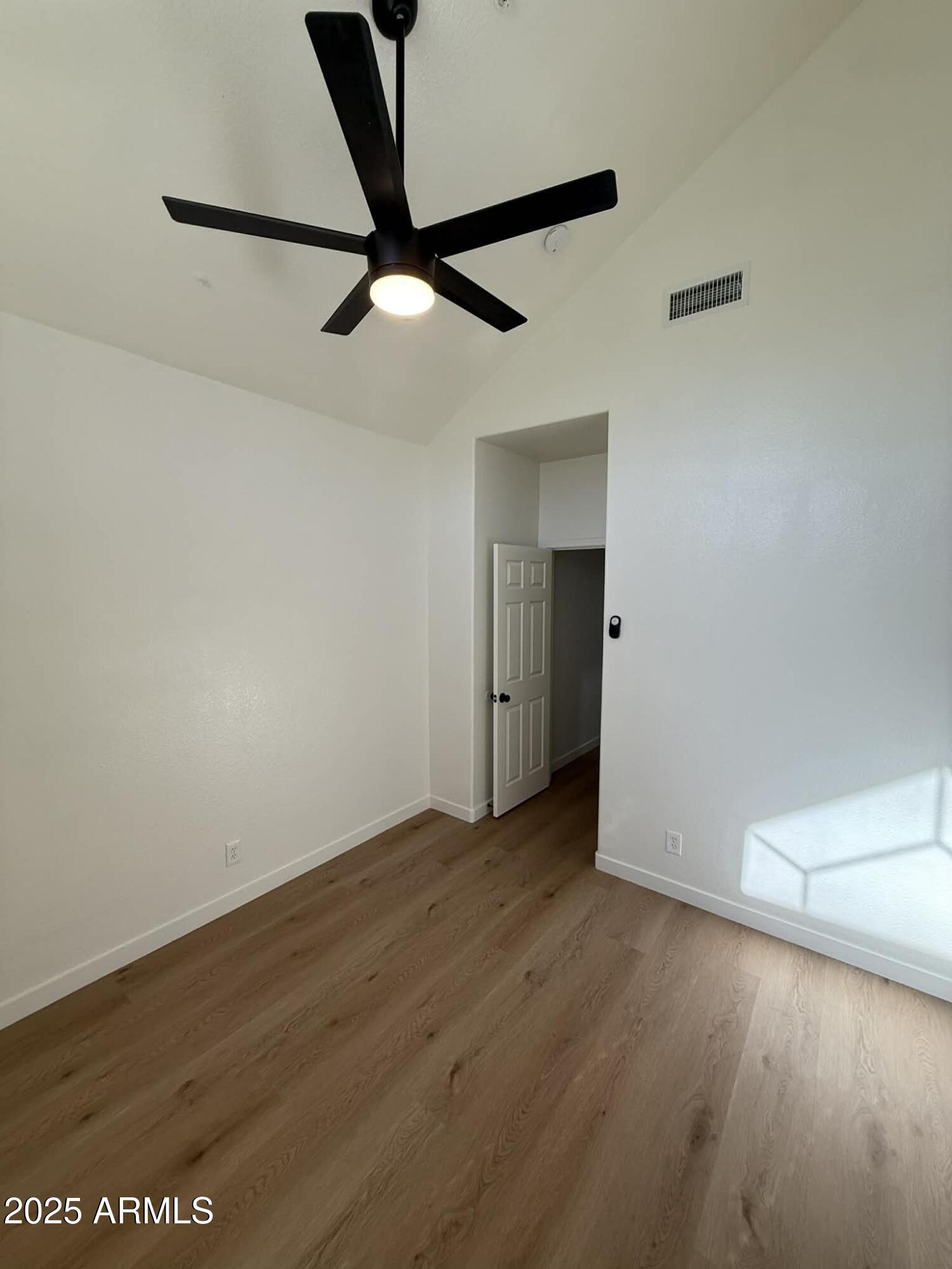 1633 East Lakeside Drive, Unit 65 Gilbert, AZ 85234 - Photo 6 of 12 wooden floor in an empty room