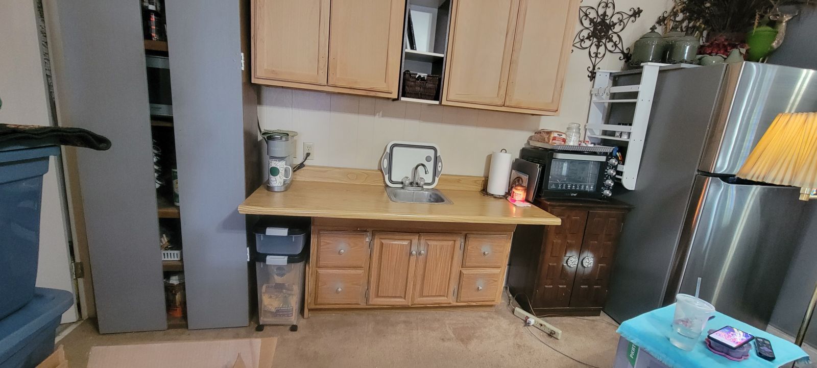 1435 West Perch Avenue Ridgecrest, CA 93555 - Photo 15 of 40 a kitchen with stainless steel appliances a refrigerator and a stove top oven