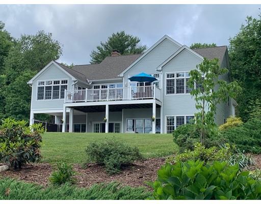 29 Beach Road Ware, MA 01082 - Photo 1 of 42 a front view of a house with a yard and trees