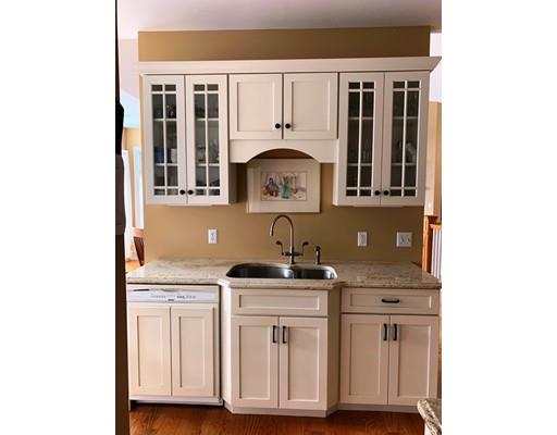 29 Beach Road Ware, MA 01082 - Photo 13 of 42 a kitchen with cabinets and a stove