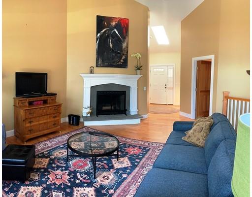 29 Beach Road Ware, MA 01082 - Photo 18 of 42 a living room with furniture and a fireplace