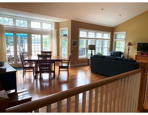 29 Beach Road Ware, MA 01082 - Photo 19 of 42 a living room with furniture wooden floor and a floor to ceiling window