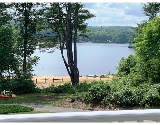 29 Beach Road Ware, MA 01082 - Photo 2 of 42 a view of a garden with a bench in the background