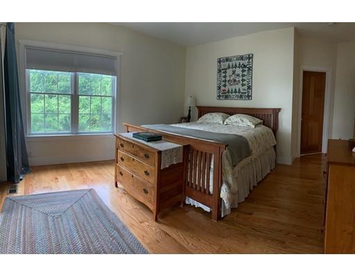 29 Beach Road Ware, MA 01082 - Photo 21 of 42 a bedroom with a bed and a window