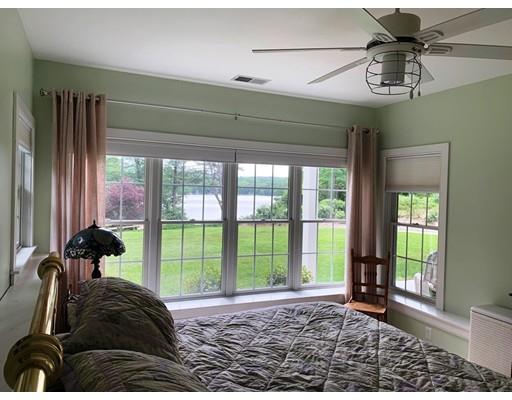 29 Beach Road Ware, MA 01082 - Photo 25 of 42 a view of a livingroom with a floor to ceiling window and wooden floor