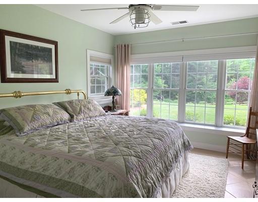 29 Beach Road Ware, MA 01082 - Photo 26 of 42 a large bed sitting in a bedroom next to a window