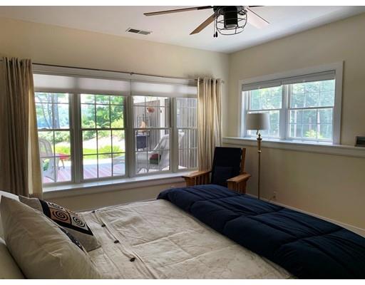 29 Beach Road Ware, MA 01082 - Photo 27 of 42 a bedroom with a bed and glass window