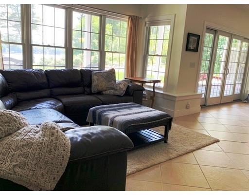29 Beach Road Ware, MA 01082 - Photo 32 of 42 a living room with furniture and large windows