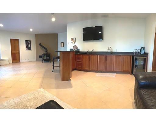29 Beach Road Ware, MA 01082 - Photo 33 of 42 a living room with furniture and a flat screen tv