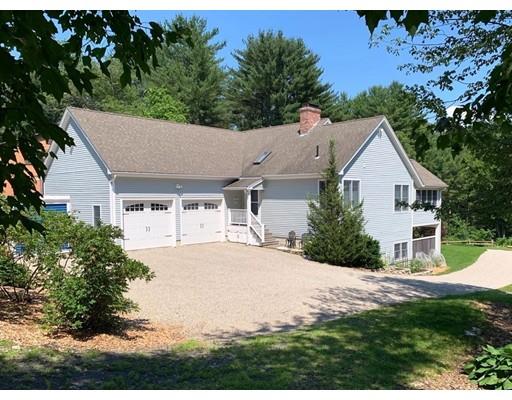 29 Beach Road Ware, MA 01082 - Photo 5 of 42 a aerial view of a house with yard and trees in the background