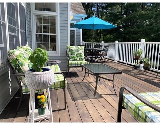 29 Beach Road Ware, MA 01082 - Photo 7 of 42 a view of balcony with outdoor seating and wooden floor