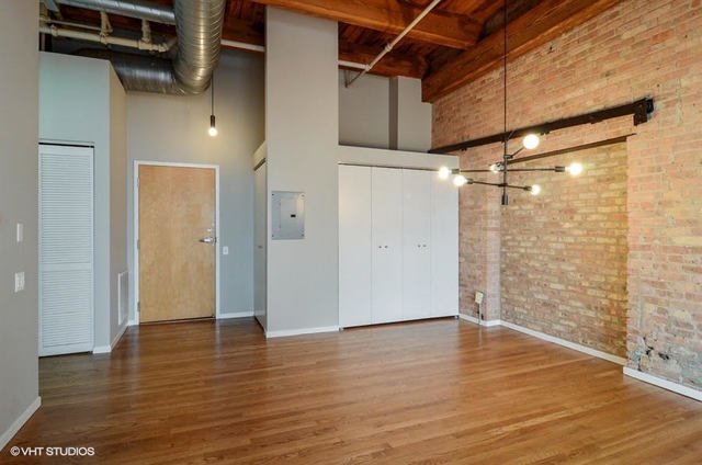 Undisclosed Address Chicago, IL 60616 - Photo 5 of 10 a view of empty room with wooden floor