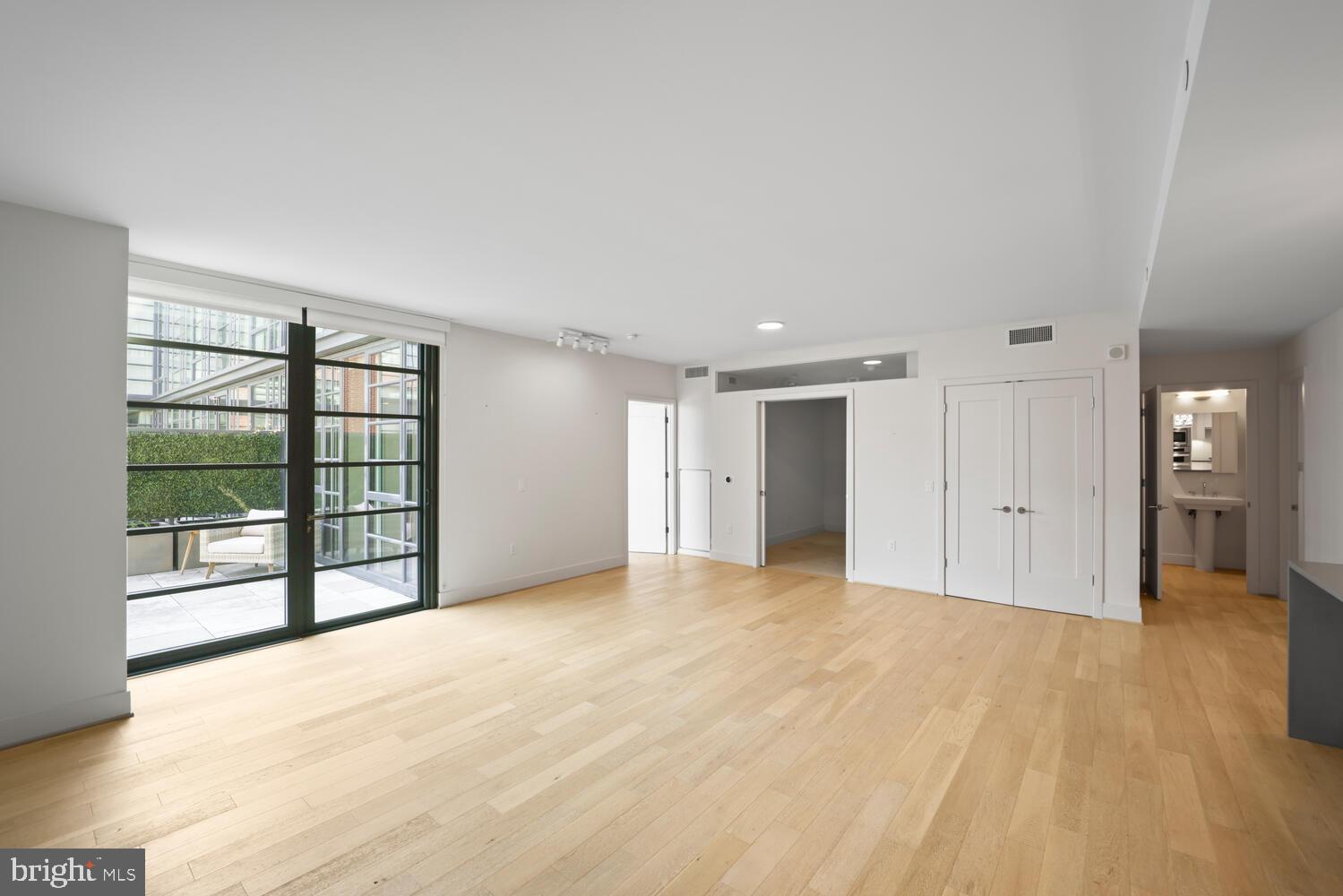45 Sutton Square Southwest, Unit 1118 Washington, DC 20024 - Photo 12 of 63 Seamless living room & dining room flow