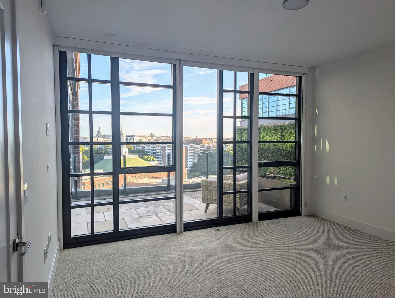 45 Sutton Square Southwest, Unit 1118 Washington, DC 20024 - Photo 23 of 63 Primary BR Wall of floor-to-ceiling windows
