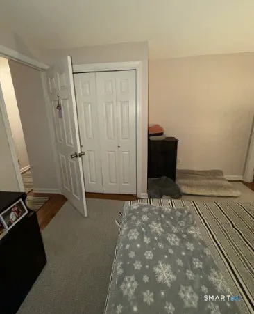 a view of an empty room and wooden floor