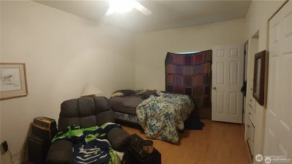 a view of hallway with wooden floor