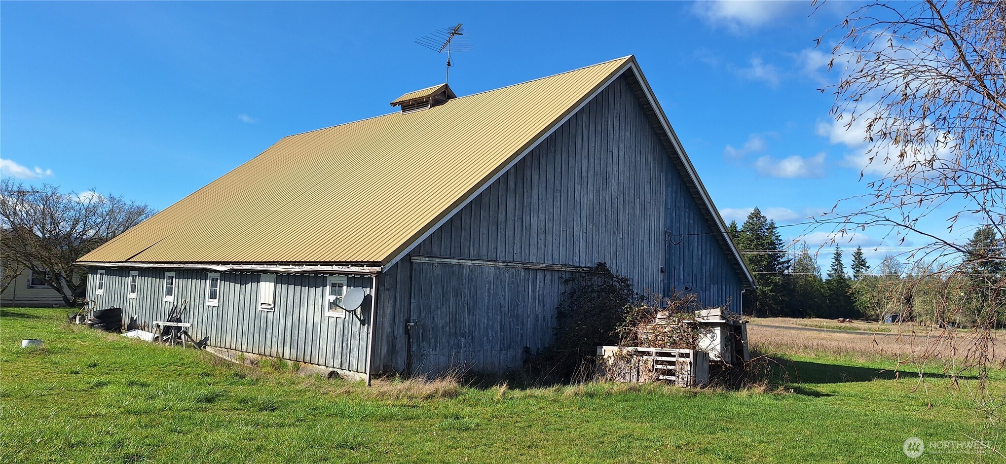 664 Rhoades Road Winlock, WA 98596 - Photo 4 of 26 a view of backyard with potted plants and a wooden fence