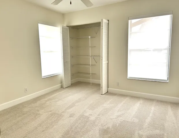 a view of a room with shelf on the wall
