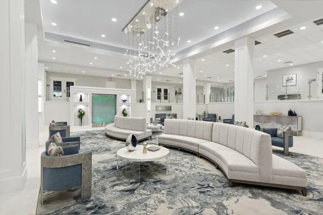 a room with lots of furniture and a large window