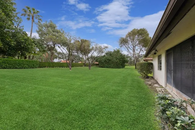 a backyard of a house with lots of green space