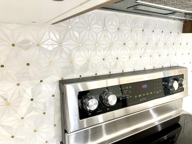 a kitchen with a sink and a refrigerator