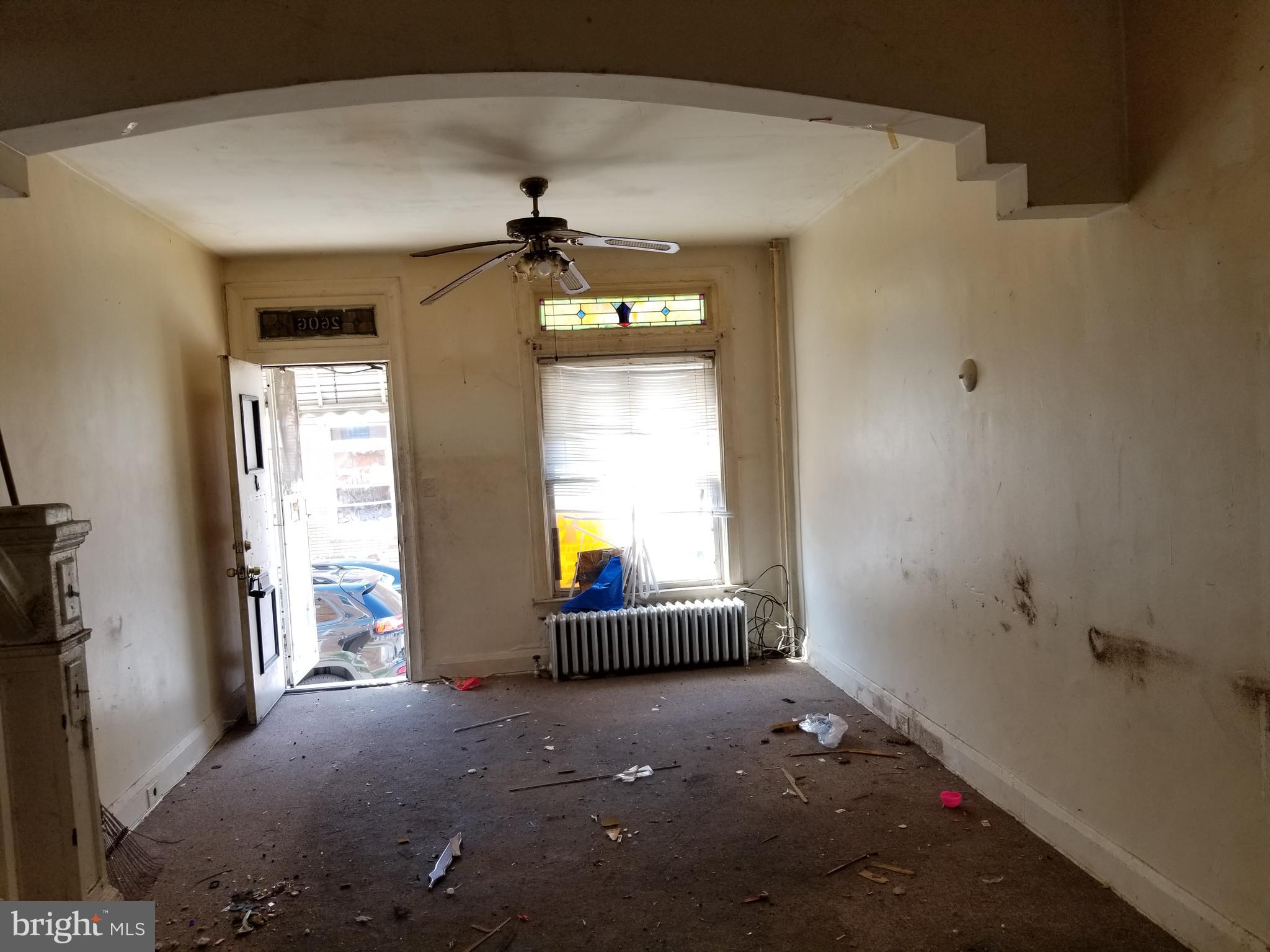 2606 Grogan Avenue Baltimore, MD 21213 - Photo 2 of 9 a living room with a chandelier