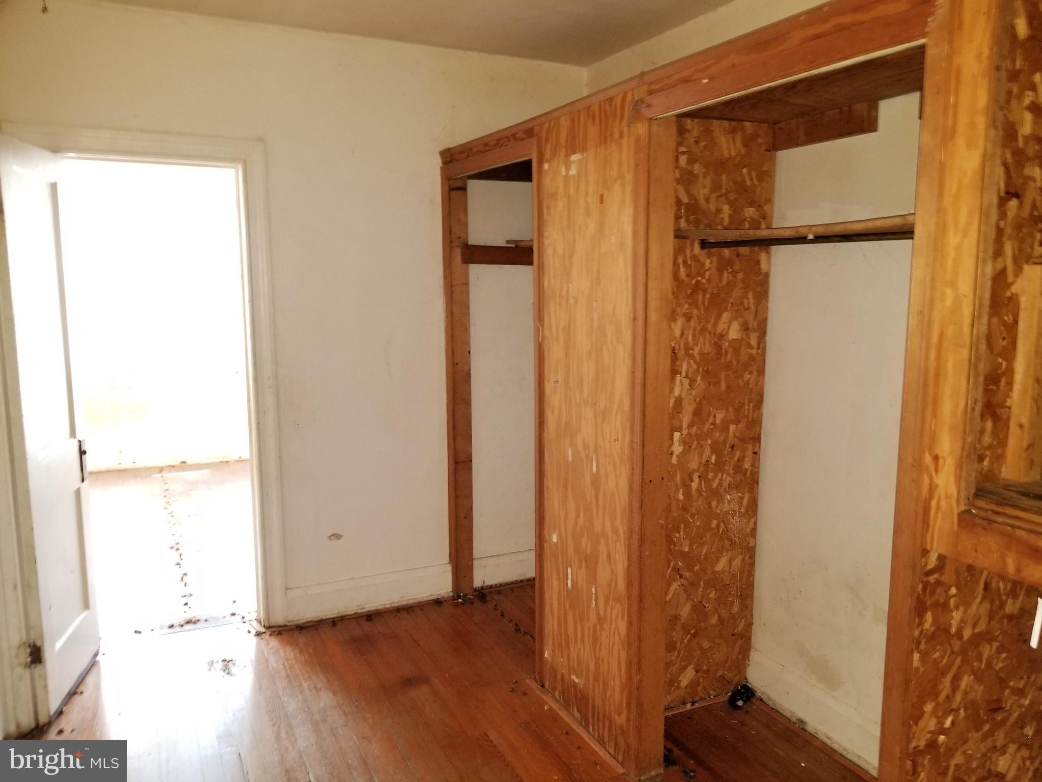 2606 Grogan Avenue Baltimore, MD 21213 - Photo 5 of 9 a view of front door with wooden floor