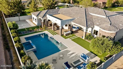 an aerial view of a house with outdoor space